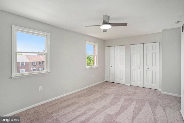 748 Jefferson St, Red Hill, PA 18076 - unfurnished bedroom with multiple closets, baseboards, carpet floors, and a ceiling fan