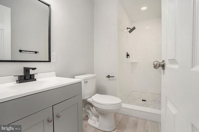 748 Jefferson St, Red Hill, PA 18076 - bathroom featuring vanity, toilet, a tile shower, and wood finished floors