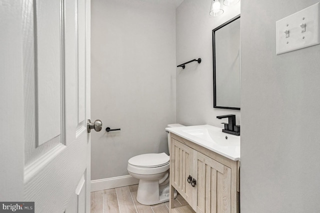 748 Jefferson St, Red Hill, PA 18076 - bathroom with vanity, toilet, and wood finished floors