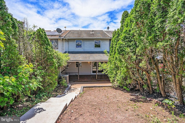 748 Jefferson St, Red Hill, PA 18076 - back of property with a porch, roof mounted solar panels, and cooling unit