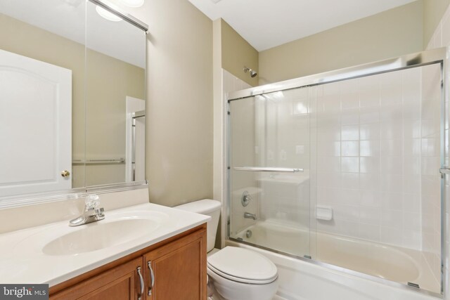 22615 Upperville Heights Sq, Ashburn, VA 20148 - bathroom featuring combined bath / shower with glass door, toilet, and vanity