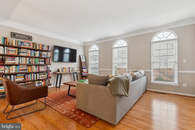 22615 Upperville Heights Sq, Ashburn, VA 20148 - living area featuring crown molding, wood finished floors, and baseboards