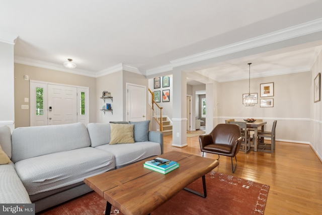 22615 Upperville Heights Sq, Ashburn, VA 20148 - living area with stairway, wood finished floors, baseboards, crown molding, and a chandelier