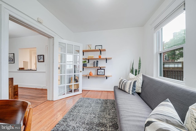 living room with wood finished floors and baseboards