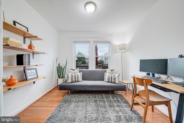 office space featuring light wood finished floors and baseboards