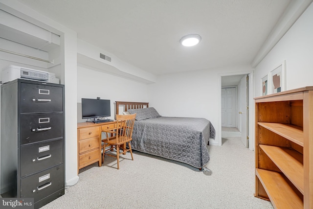 bedroom featuring carpet and baseboards