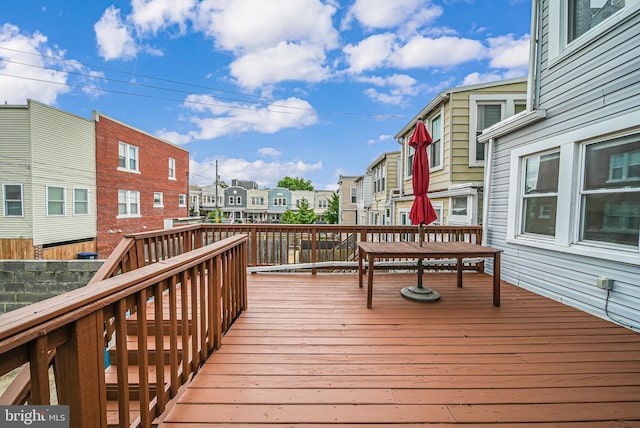 wooden terrace featuring a residential view