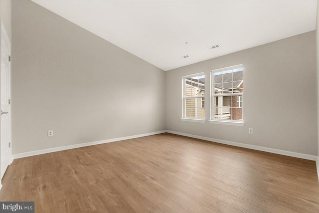 2400 Dominion Dr Unit 3D, Frederick, MD 21702 - unfurnished room with wood finished floors, baseboards, and lofted ceiling