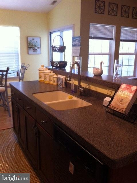2400 Dominion Dr Unit 3D, Frederick, MD 21702 - kitchen with a sink, plenty of natural light, dark countertops, and black dishwasher
