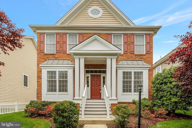 42522 Neighborly Ln, Chantilly, VA 20152 - colonial-style house featuring a standing seam roof, fence, and metal roof