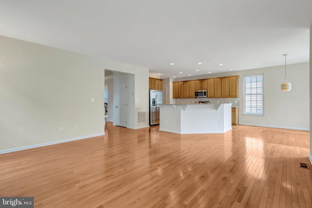 42522 Neighborly Ln, Chantilly, VA 20152 - unfurnished living room with light wood finished floors, baseboards, and recessed lighting