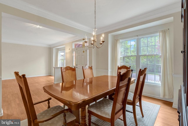 42522 Neighborly Ln, Chantilly, VA 20152 - dining area featuring healthy amount of natural light, light wood-style floors, ornamental molding, a chandelier, and baseboards