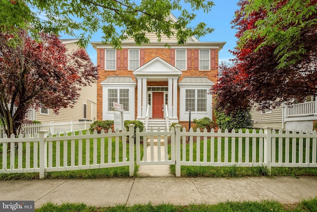 42522 Neighborly Ln, Chantilly, VA 20152 - colonial-style house with brick siding and a fenced front yard
