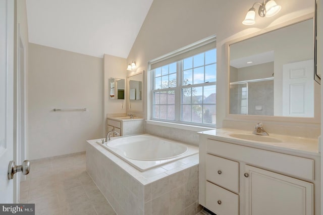 42522 Neighborly Ln, Chantilly, VA 20152 - bathroom featuring a stall shower, a garden tub, two vanities, lofted ceiling, and tile patterned floors