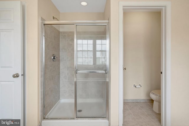 42522 Neighborly Ln, Chantilly, VA 20152 - full bath featuring a stall shower, tile patterned flooring, toilet, and baseboards