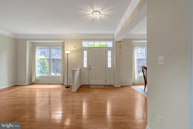 42522 Neighborly Ln, Chantilly, VA 20152 - foyer featuring crown molding, plenty of natural light, light wood-type flooring, and baseboards