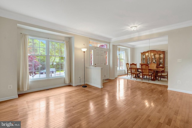 42522 Neighborly Ln, Chantilly, VA 20152 - living area with ornamental molding, light wood finished floors, baseboards, and a chandelier