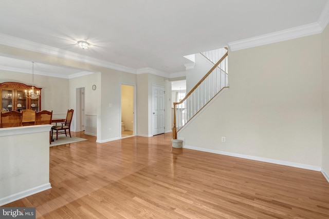 42522 Neighborly Ln, Chantilly, VA 20152 - unfurnished living room with a chandelier, stairs, light wood-type flooring, ornamental molding, and baseboards