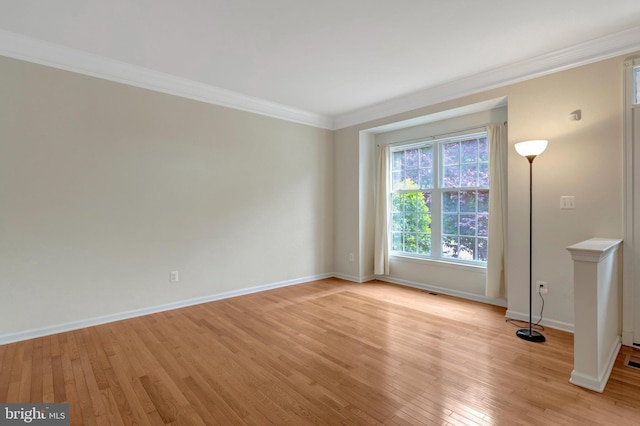 42522 Neighborly Ln, Chantilly, VA 20152 - spare room with light wood finished floors, baseboards, and crown molding