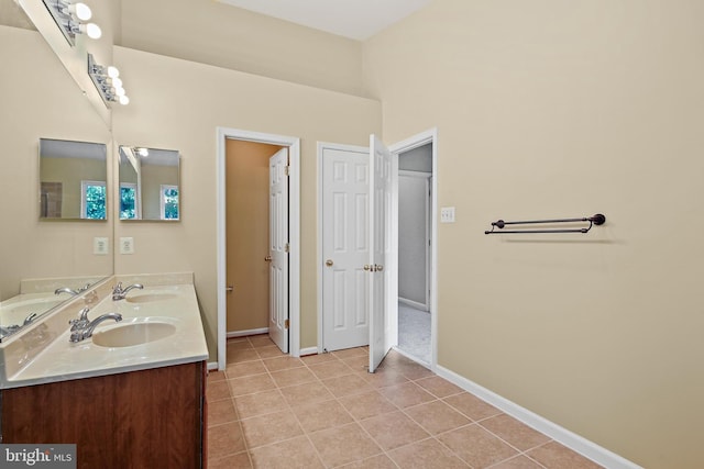 10016 Love Song Ct, Laurel, MD 20723 - full bathroom with tile patterned flooring, baseboards, and double vanity