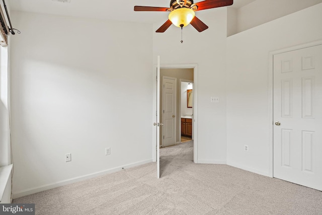10016 Love Song Ct, Laurel, MD 20723 - unfurnished bedroom featuring light colored carpet, baseboards, a high ceiling, and ceiling fan