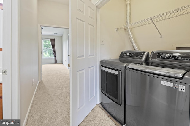 10016 Love Song Ct, Laurel, MD 20723 - laundry room featuring light carpet, independent washer and dryer, and baseboards