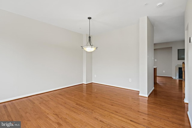 10016 Love Song Ct, Laurel, MD 20723 - empty room with wood finished floors, baseboards, and a smoke detector