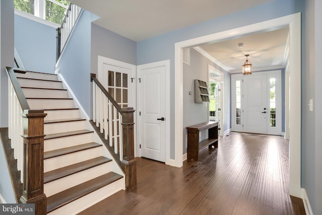 133 Greentree Farm Dr, Dickerson, MD 20842 - entrance foyer with dark wood finished floors, stairs, baseboards, and ornamental molding