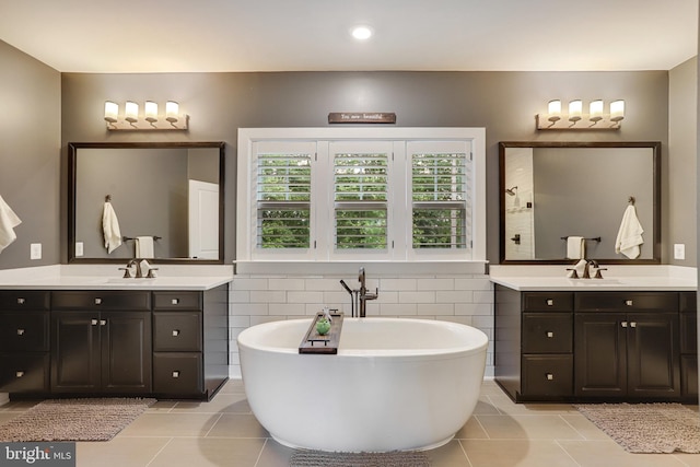 133 Greentree Farm Dr, Dickerson, MD 20842 - bathroom with tile patterned flooring, two vanities, and a soaking tub