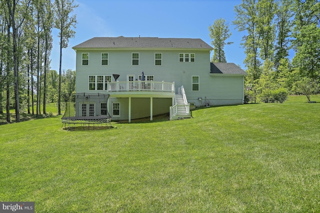133 Greentree Farm Dr, Dickerson, MD 20842 - rear view of property featuring stairway, a wooden deck, a yard, and a trampoline