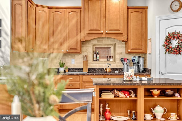 2906 Cornus Way, Joppa, MD 21085 - kitchen featuring open shelves, backsplash, brown cabinetry, and dark stone countertops