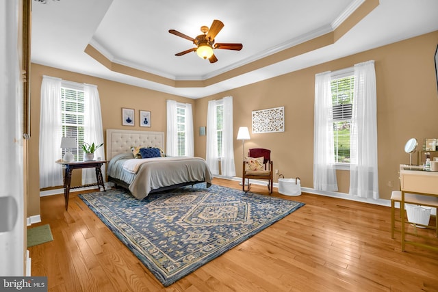 2906 Cornus Way, Joppa, MD 21085 - bedroom featuring a tray ceiling, ornamental molding, hardwood / wood-style floors, and baseboards