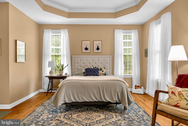 2906 Cornus Way, Joppa, MD 21085 - bedroom featuring a raised ceiling, crown molding, light wood-style flooring, and baseboards