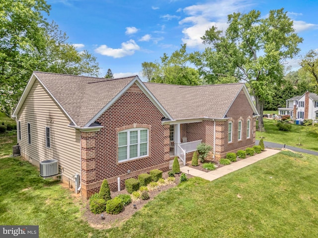 2906 Cornus Way, Joppa, MD 21085 - view of front of house with roof with shingles, brick siding, cooling unit, and a front yard