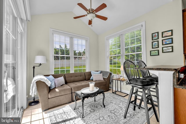 2906 Cornus Way, Joppa, MD 21085 - living room with ceiling fan, vaulted ceiling, light tile patterned floors, and baseboards