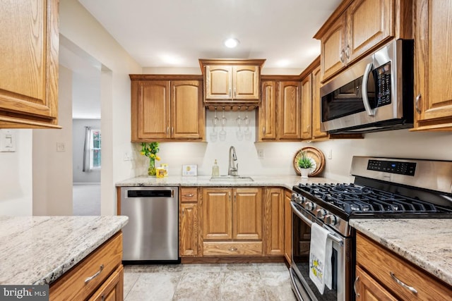 23 Village Ln Building 3 # 23A, Mount Laurel, NJ 08054 - kitchen featuring appliances with stainless steel finishes, a sink, light stone countertops, brown cabinetry, and recessed lighting