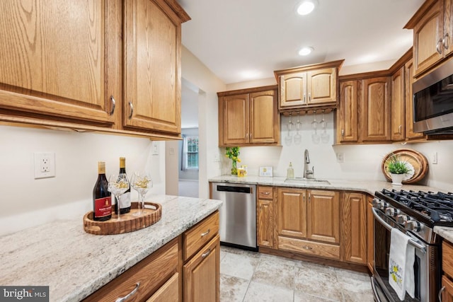 23 Village Ln Building 3 # 23A, Mount Laurel, NJ 08054 - kitchen with appliances with stainless steel finishes, a sink, light stone counters, recessed lighting, and brown cabinets
