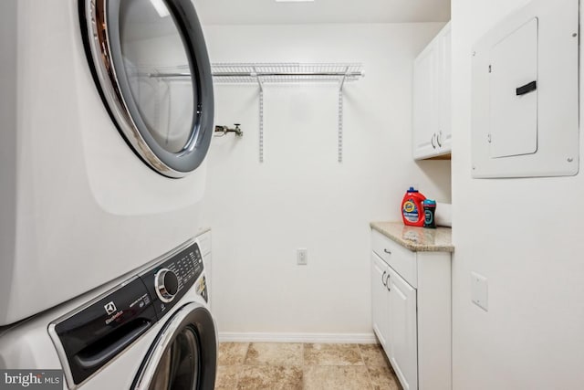 23 Village Ln Building 3 # 23A, Mount Laurel, NJ 08054 - laundry area with cabinet space, stacked washer / dryer, electric panel, and baseboards
