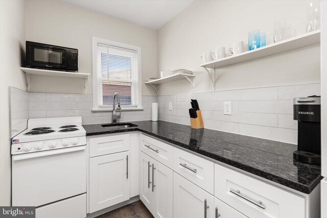 1004 Philadelphia Ave, Ocean City, MD 21842 - kitchen with electric stove, open shelves, a sink, black microwave, and white cabinets