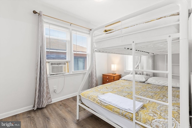 1004 Philadelphia Ave, Ocean City, MD 21842 - bedroom featuring wood finished floors, multiple windows, cooling unit, and baseboards