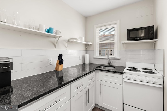 1004 Philadelphia Ave, Ocean City, MD 21842 - kitchen featuring white range with electric cooktop, black microwave, a sink, open shelves, and backsplash