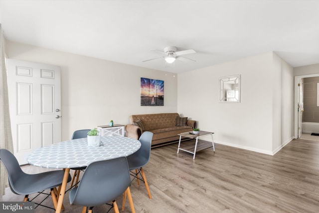 1004 Philadelphia Ave, Ocean City, MD 21842 - dining space featuring ceiling fan, light wood finished floors, and baseboards