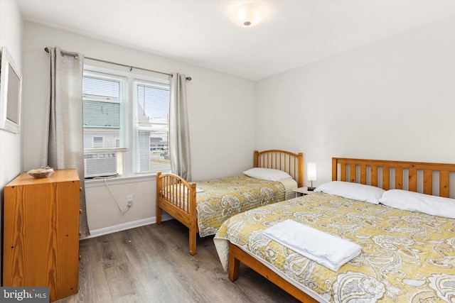 1004 Philadelphia Ave, Ocean City, MD 21842 - bedroom with wood finished floors, baseboards, and cooling unit