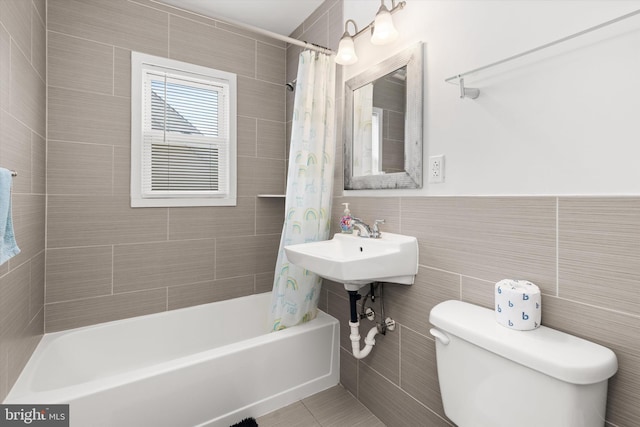 1004 Philadelphia Ave, Ocean City, MD 21842 - bathroom with tile walls, toilet, and shower / bathtub combination with curtain