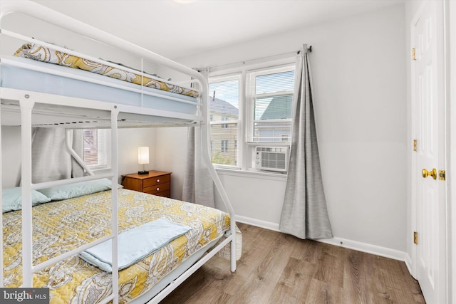 1004 Philadelphia Ave, Ocean City, MD 21842 - bedroom featuring wood finished floors, baseboards, and cooling unit