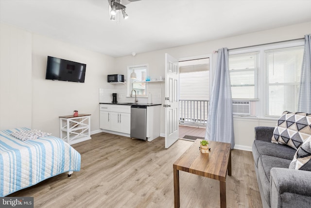 1004 Philadelphia Ave, Ocean City, MD 21842 - bedroom with light wood-style flooring, baseboards, a sink, and refrigerator