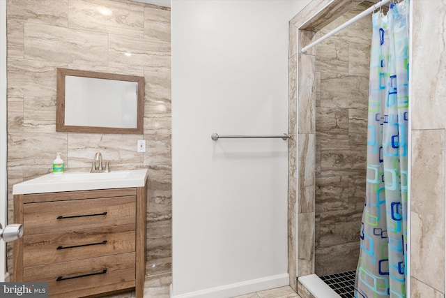 1004 Philadelphia Ave, Ocean City, MD 21842 - bathroom with a tile shower, vanity, and baseboards