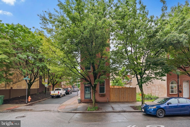view of front of home featuring brick siding