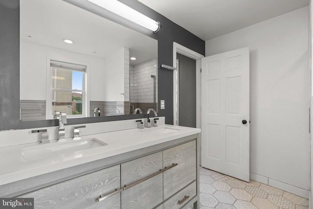full bath with tile patterned flooring, a stall shower, double vanity, and recessed lighting