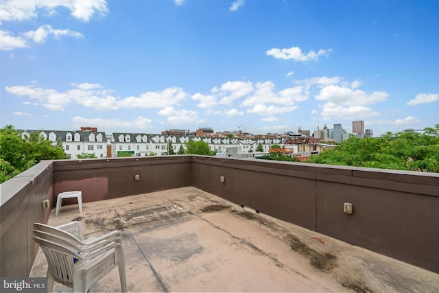 view of patio featuring a city view and a balcony